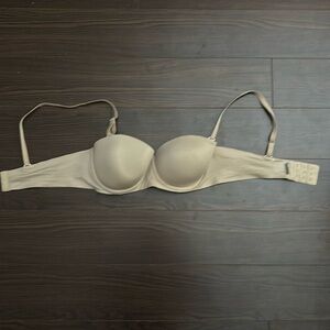 Tan bra with removable straps and wide band. Has underwire